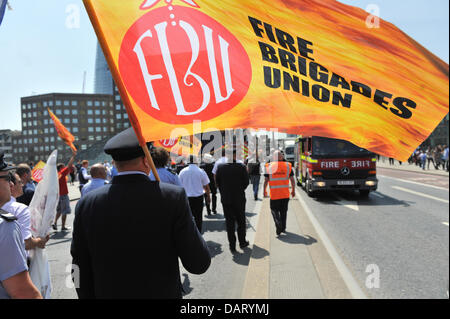 London Bridge, London, UK. 18th July 2013. Firecrew cross London Bridge at the protest march against the cuts to services. Credit:  Matthew Chattle/Alamy Live News Stock Photo