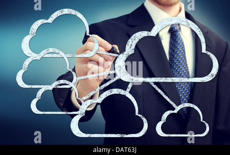 Cloud flow chart with businessman on blue background Stock Photo