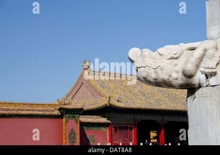 China, Beijing, Forbidden City. Inner palace wall with traditional mythological carved stone dragon faces. Stock Photo