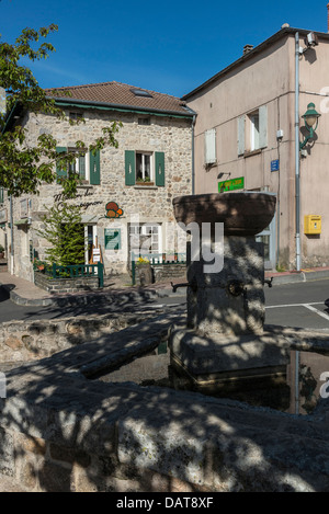 Village fountain at Saint Bonnet le Froid, Haute-Loire, Auvergne, France Stock Photo