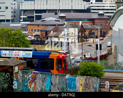 Tram and concrete buildings in Sheffield city centre South Yorkshire England UK Stock Photo