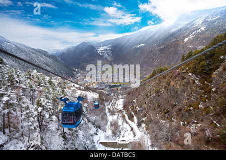 Encamp town in Andorra and cable car for lifting skiers and snowboarders to the top of the mountain Stock Photo
