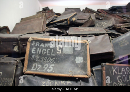 Behind a display glass, suitcases of Jewish victims of the Holocaust at Auschwitz-Birkenau concentration camp near Krakow. Stock Photo