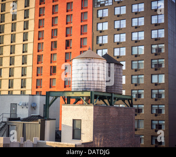 Water tanks on the rooftop of an office building in midtown Manhattan in New York Stock Photo