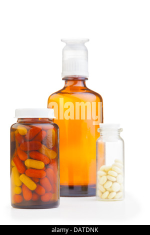 little bottles and jars with yellow and red and white pills with mixture from flue on background Stock Photo
