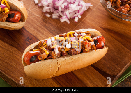 Homemade Hot Chili Dog with Cheddar Cheese and Onions Stock Photo