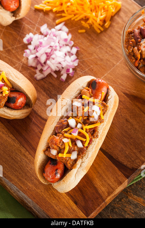 Homemade Hot Chili Dog with Cheddar Cheese and Onions Stock Photo