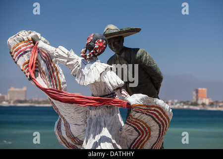 'Bailarines de Vallarta sculpture by Jim Demetro is one of 15 unique sculptures that line the Puerto Vallarta malecon in Mexico. Stock Photo