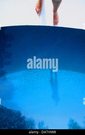 Feet standing by side of swimming pool Stock Photo - Alamy