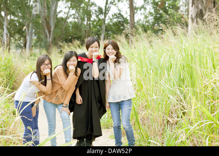 Asian friends in graduation Stock Photo