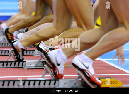 Legs are set to go at the start of a Ladies' 60m Prelims of the European Athletics Indoor Championships in Birmingham, United Kingdom, Saturday, 03 March 2007. Photo: Arne Dedert Stock Photo