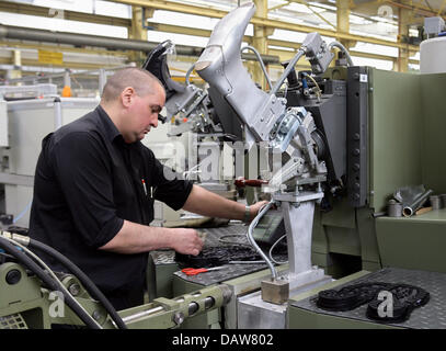 An employee of Kloeckner-Desma shoe-machine producer is pictured at the company's plant in Achim near Bremen, Germany, Thursday, 08 March 2007. Desma is a sub-company of Kloeckner-Werke AG, which the Salzgitter AG will take over for an undisclosed price, according to news reports from Thursday, 08 March 2007. The Salzgitter AG company, said it had entered a contract with WCM Group  Stock Photo