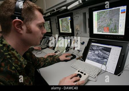 A German Bundeswehr soldier surveys the flight of a new reconnaissance ...