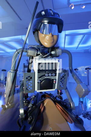 Humanoid robot jockey-robot K-MEL is on display in a blue room at the exhibition 'Die Roboter kommen! Mensch - Maschine - Kommunikation' at the 'Museum fuer Kommunikation' in Berlin, Wednesday, 4 April 2007. The 15kg robot was developed for Camel races, as child jockeys have been banned meanwhile. The exhibition runs from 5th April to 2nd September 2007 and presents the past and pr Stock Photo