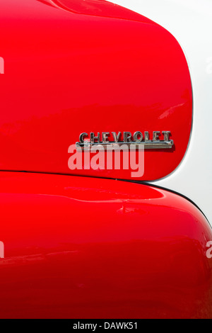 1950s red and white Chevrolet 3100 pickup name badge detail Stock Photo