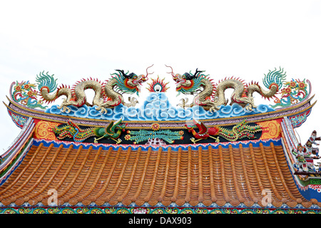 Dragon sculpture on the roof of Chinese temple. Stock Photo