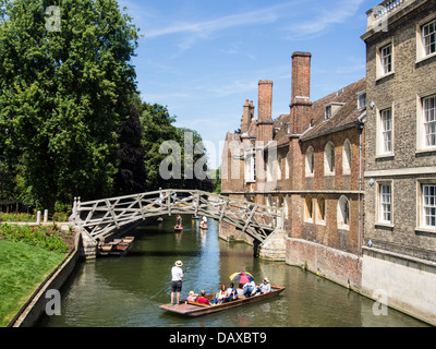 Punting on the River Cam near the Mathematical Bridge in Cambridge Stock Photo
