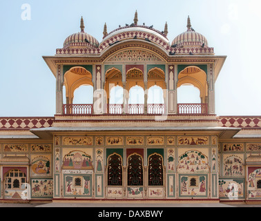 Domed upper structure with wall paintings on mansion outside India's Jaipur. Stock Photo