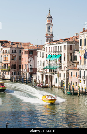 A water  ambulance speeds along the Grand Canal Venice, as seen from the Rialto Bridge Stock Photo