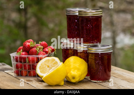 Fresh homemade strawberry lemon curd jam or preserves with strawberries and lemons Stock Photo