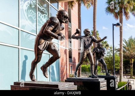 Bronze statues of Tim Tebow, Steve Spurrier and Danny Wuerffel, UF Heisman trophy winners in front of Ben Hill Griffin stadium. Stock Photo