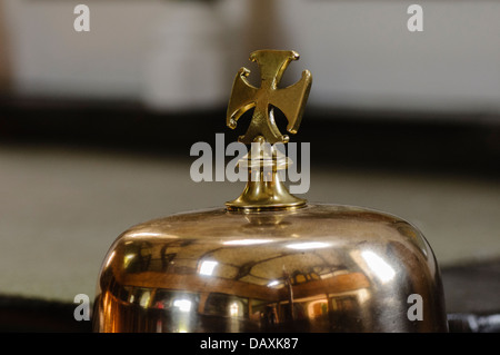 Brass mass bell in a Catholic church Stock Photo
