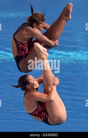 Barcelona, Spain. 20th July, 2013. Jennifer Abel (top) and Pamela Ware of Canada in action during the women's 3m Synchro Springboard diving preliminaries of the 15th FINA Swimming World Championships at Montjuic Municipal Pool. Credit:  dpa picture alliance/Alamy Live News Stock Photo