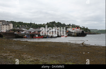 Fishing boats in Oban harbour at low tide Scotland  June 2013 Stock Photo
