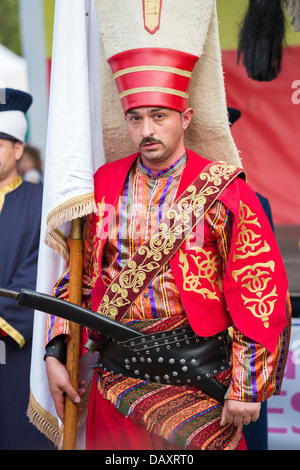 Unidentified member of military fanfare Mehter wears traditional Janissary costume during Turkish Festival, Bucharest, Romania. Stock Photo