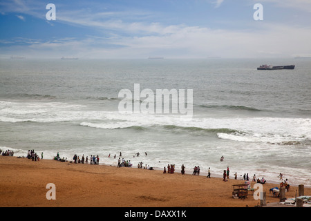 Tourists enjoying on the beach, Visakhapatnam, Andhra Pradesh, India Stock Photo