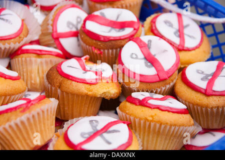 London, UK. 20th July, 2013. Cakes on offer to protesters as UK Uncut hold demonstrations outside two London branches of HSBC in protest against what they say is tax dodging by the bank, as welfare cuts drive more people to reliance on foodbanks. Credit:  Paul Davey/Alamy Live News Stock Photo