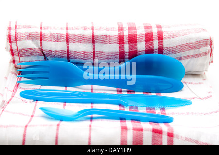 Dish towel with plastic cutlery Stock Photo
