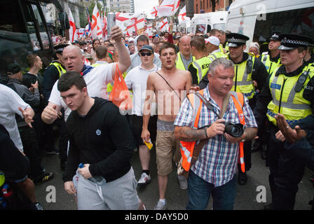 Birmingham, UK. 20th July, 2013. English Defence League supporters were to be escorted by police to Centenary Square in central Birmingham for a planned EDL demonstration, however members of the group soon pushed through containment lines and police quickly lost control. 20/07/2013 Birmingham, United Kingdom. Credit:  Peter Manning/Alamy Live News Stock Photo