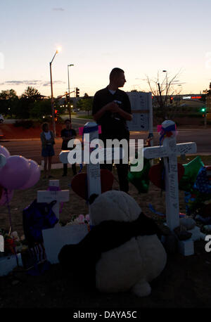 Aurora, Colorado, USA. 20th July, 2013. July 20, 2013 - Aurora, Colorado, U.S - People gather at the site of the Aurora Century 16 Memorial across the street from the theater to honor the victims during the 1 year Anniversary. Credit:  Hector Acevedo/ZUMAPRESS.com/Alamy Live News Stock Photo