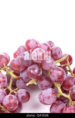 Cluster of red grapes isolated on a white background Stock Photo