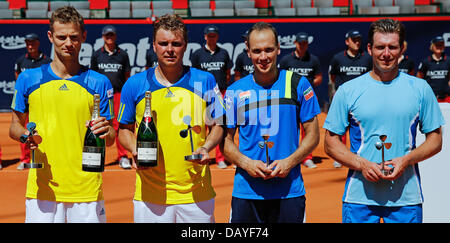 Polish tennis players Mariusz Fyrstenberg (L-R) and Marcin Matkowski present their trophies after their victory of the doubles final against Bruno Soares from Brazil and Alexander Peya from Brazil at the ATP tournament in Hamburg, Germany, 21 July 2013. Photo: AXEL HEIMKEN Stock Photo