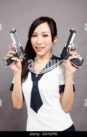 School girl plays gun. Stock Photo