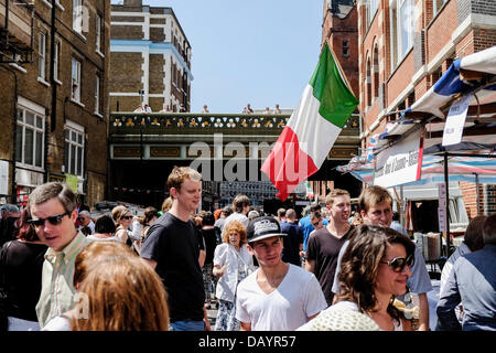 London, UK. 21st July 2013.  People gather in an Italian themed street market which is held to celebrate the Procession in Honour of Our Lady of Mount Carmel.  Photographer: Gordon Scammell/Alamy Live News Stock Photo