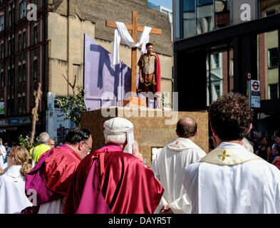 London, UK. 21st July 2013.  Priests from St Peter's Church watch as the Procession in Honour of Our Lady of Mount Carmel makes it's way along Clerkenwell Rd in London.  Photographer: Gordon Scammell/Alamy Live News Stock Photo