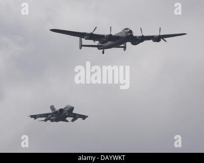 Fairford, UK. 20th July, 2013. To celebrate the 70th anniversary of the Dambuster raid on the Ruhr dams by the Avro Lancasters of 617 Squadron RAF the Battle of Britain Memorial Flight Lancaster performed a memorial flypast in company with a Tornado GR4 jet serving with the present day 617 Squadron at the Royal International Air Tattoo at RAF Fairford, Gloucstershire Stock Photo