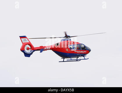 Fairford, UK. 20th July, 2013. Eurocopter EC135T2 helicopter owned by Devon Air Ambulance and shortly to enter service, demonstrating its capabilities in a simulated combined exercise with Fire and Police helicopters at the 2013 Royal International Air Tattoo Stock Photo