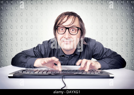 Funny hacker typing on the keyboard Stock Photo