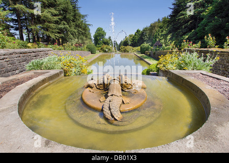 Renaissance Dolphin Stone Sculptures Water Fountain in Public Parks Pond Stock Photo