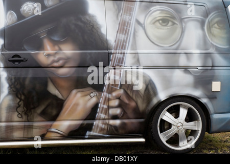 Custom painted VW Camper van with Slash 'Saul Hudson' and John Lennon painted on the side Stock Photo