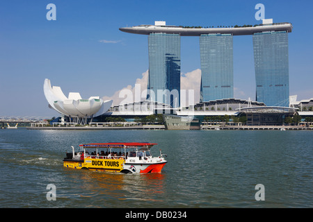 Duck Tours DUKW amphibious vehicle passing by the Marina Bay Sands Hotel, Singapore. Stock Photo