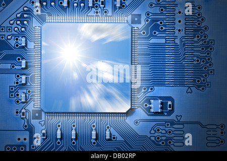 Fast CPU / Processor with sun and cloud graphic, representing power, speed and efficiency, on blue electronic circuit board Stock Photo