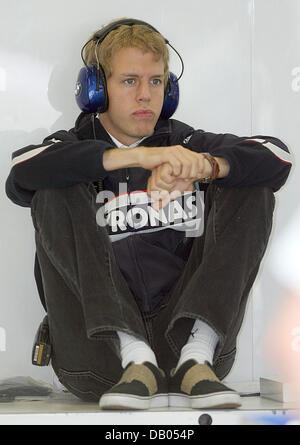 German Formula One pilot Sebastian Vettel of BMW Sauber sits inside the pit at Magny-Cours race track near Nevers, France, 29 June 2007. The Formula One Grand Prix of France 2007 will be held on 01 July. Photo: Carmen Jaspersen Stock Photo