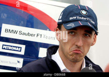 Polish Formula One pilot Robert Kubica of BMW Sauber grimaces during an interview in the paddock of the Silverstone Circuit in Silverstone, United Kingdom, 05 July 2007. The 2007 Formula 1 British Grand Prix will be held on 08 July. PHOTO: JENS BUETTNER Stock Photo