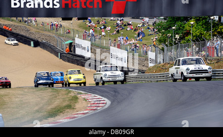 Old saloon cars racing on race track Stock Photo