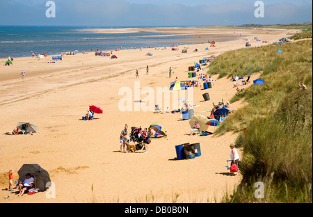 People on wide sandy beach Hunstanton Norfolk England Stock Photo